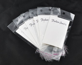 100 Self-Seal Bags with Earring Display Card and Hang Tag size 10.8x6cm (4-1/4" x 2-3/8") bulk cello jewelry baggies, cellophane bag bag0067