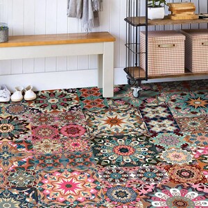 May include: A patterned floor covering with a patchwork design of floral and geometric motifs in pink, teal, orange, and brown. The floor covering is made up of square tiles, creating a vibrant and decorative surface for a room.