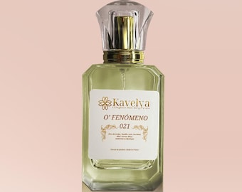 May include: A rectangular glass perfume bottle with a pale green liquid, a gold collar, and a clear faceted cap. The white label features the text Kavelya, O' FENÓMENO 021, and a list of ingredients including Fève de tonka, Vanille, Lait, Caramel, Miel, Cacao, Musc, Ambrette et Mystique.