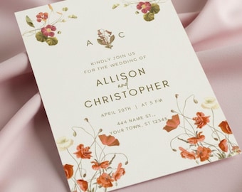 May include: Wedding invitation with floral accents. The invitation features the names "Allison and Christopher" and event details. The design includes red and white flowers and green leaves on a cream background.
