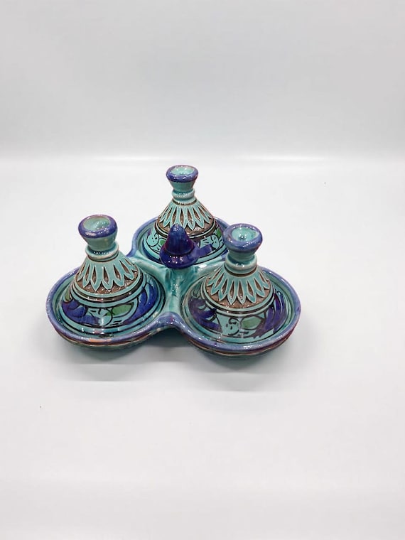 A full Moroccan handmade ceramic condiment set in striking blue-green — a complete, eye-catching table setup that screams 'I brought this back from a souk'.