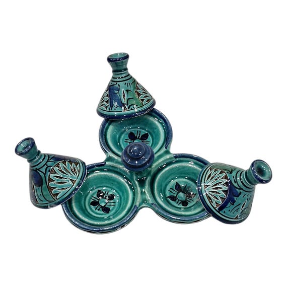 A full Moroccan handmade ceramic condiment set with tagine-style dishes — the kind of artisan tablescape piece that makes a dinner party look like you just got back from Marrakech.