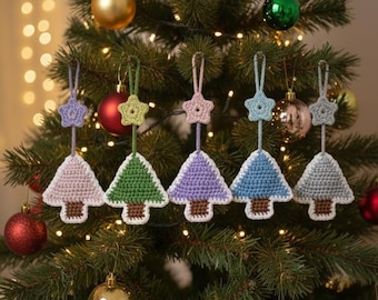 May include: Five crocheted Christmas tree ornaments hanging in a row. Each tree features a different pastel or solid color, a brown trunk, and a white border. Above each tree is a small crocheted star attached to a matching hanging loop.
