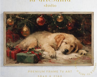 May include: A framed print of a sleeping golden retriever puppy under a Christmas tree with ornaments and wrapped gifts. The artwork has a vintage, painterly style with warm colors and the text "la artesanía studio".