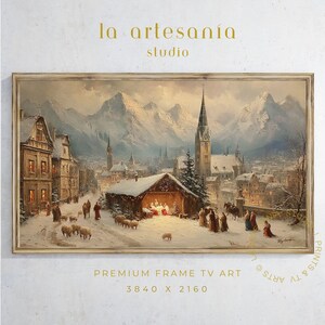 Puede incluir: Pintura enmarcada de un paisaje invernal con un pueblo nevado, una iglesia y montañas. La obra de arte incluye el texto "la artesanía studio" y "PREMIUM FRAME TV ART 3840 X 2160".