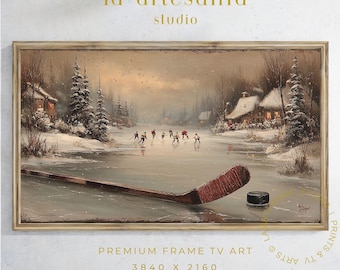 May include: A framed winter landscape painting featuring a hockey game on a frozen pond. A hockey stick and puck are in the foreground. The artwork has a vintage aesthetic, with the text "la artesanía studio" at the top and "PREMIUM FRAME TV ART" at the bottom.