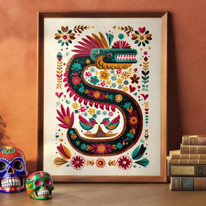 May include: A framed art print featuring a colorful illustration of a serpent with floral and bird motifs. Decorative skulls and a potted plant are on a wooden surface. The artwork has a brown wooden frame.