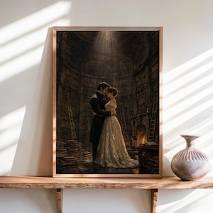 May include: A rectangular framed wall art print depicting a couple in formal attire embracing inside a dark, multi-story library with tall bookshelves, ladders, and a fireplace, illuminated by a single beam of light from above.