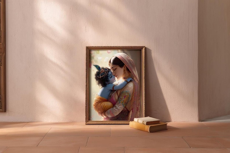 A framed painting of a woman embracing a child is displayed on a wall, with a stack of books and a doorway visible in the background.