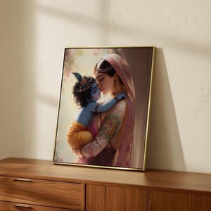 a framed painting of a woman embracing a child, likely a baby, with a warm and tender expression.