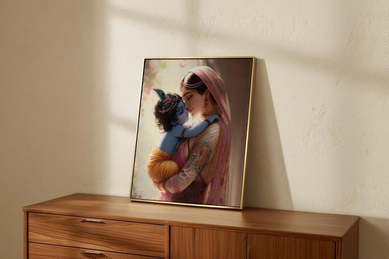 a framed painting of a woman embracing a child, likely a baby, with a warm and tender expression.