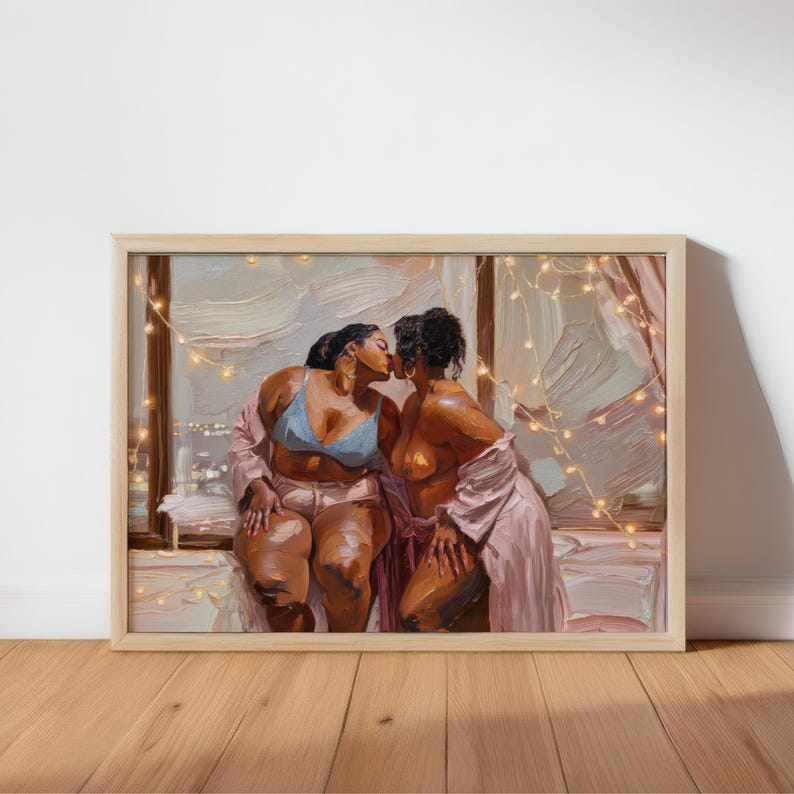 May include: An oil painting in a light wood frame depicting two figures kissing near a window. One figure wears a light blue bra and pink shorts, while the other wears a pink robe. String lights are draped across the scene with a city view.