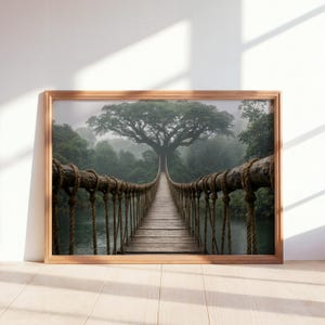 May include: A rectangular wall art print in a light wood frame featuring a perspective view of a wooden suspension bridge with thick rope railings leading toward a large, dense green tree in a misty, foggy forest setting over dark water.