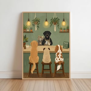May include: A framed wall art print depicting a black dog barista wearing an apron behind a coffee counter, serving three dogs sitting on wooden stools. The scene features hanging pendant lights, potted plants, and a small chalkboard sign labeled Menu.