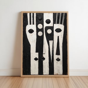 May include: A rectangular wall art piece featuring a high-contrast black and white abstract composition. The design displays stylized, elongated vertical shapes and circular forms arranged in a balanced pattern, all enclosed within a light wood frame.