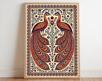 May include: A framed artwork featuring two symmetrical peacocks with elaborate tail feathers. The birds are rendered in vibrant red, orange, blue, and yellow hues against a cream background. The artwork is framed in a light brown wooden frame.