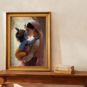 a framed painting of a woman embracing a child, likely a depiction of the Hindu deity Radha and her son, Krishna. The painting is displayed on a wooden shelf, and there are some books placed next to it.