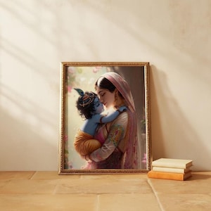 A framed image of a woman embracing a child, likely a baby, is displayed on a wall next to a stack of books.