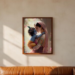 A framed photograph of a woman embracing a child, likely a baby, is hanging on a wall above a brown leather couch.
