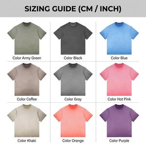 May include: A sizing guide chart displaying nine short-sleeve t-shirts in various solid colours including army green, black, blue, coffee, grey, hot pink, khaki, orange, and purple. The text SIZING GUIDE (CM / INCH) appears at the top of the image.