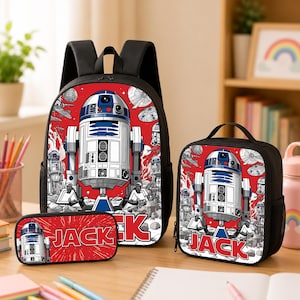 May include: A black backpack, a lunch bag, and a pencil case set featuring a red background with a white and blue R2-D2 robot graphic. Each item displays the name JACK in bold white letters with a red outline, surrounded by space-themed imagery.