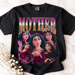 May include: Black t-shirt featuring a graphic of the character Mother Gothel from the movie Tangled. The design includes the text "MOTHER Gothel" in a retro style, with multiple images of the character.