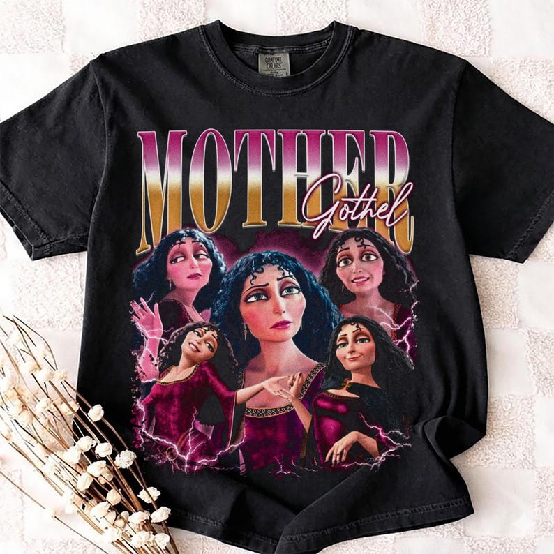 May include: Black t-shirt featuring a graphic of the character Mother Gothel from the movie Tangled. The design includes the text "MOTHER Gothel" in a retro style, with multiple images of the character.