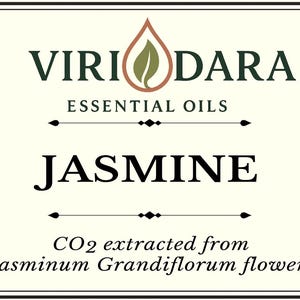 May include: A label for a 30 ml bottle of jasmine essential oil. The label features the brand name "Viri Dara" and the word "Jasmine" in large letters. It also includes text indicating the oil is CO2 extracted from Jasminum Grandiflorum flowers.