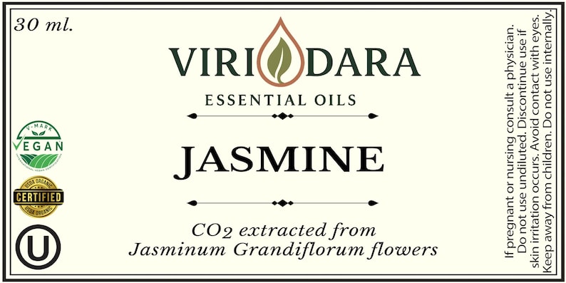 May include: A label for a 30 ml bottle of jasmine essential oil. The label features the brand name "Viri Dara" and the word "Jasmine" in large letters. It also includes text indicating the oil is CO2 extracted from Jasminum Grandiflorum flowers.