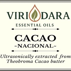 May include: A label for Viri Dara essential oils, with the text "Cacao - Nacional." The label includes the text "Essential Oils" and "Ultrasonically extracted from Theobroma Cacao butter." It also has a vegan certification and a volume of 30 ml.