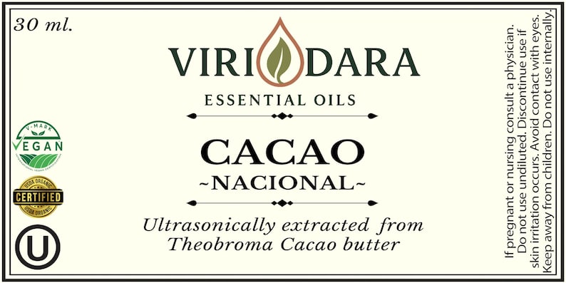May include: A label for Viri Dara essential oils, with the text "Cacao - Nacional." The label includes the text "Essential Oils" and "Ultrasonically extracted from Theobroma Cacao butter." It also has a vegan certification and a volume of 30 ml.