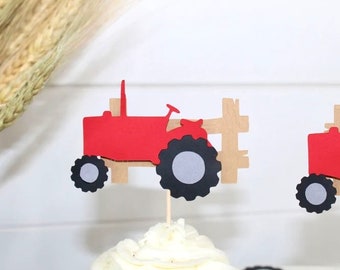May include: Red tractor cupcake toppers with black wheels and a light brown fence design. These farm-themed decorations are perfect for a birthday party or other special event. The toppers are attached to wooden sticks.