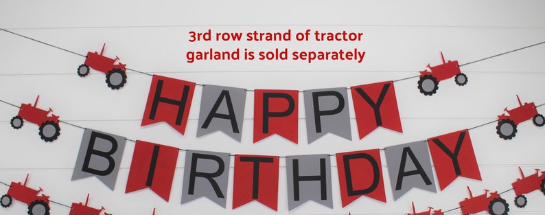 May include: Red and gray happy birthday banner with black letters. The banner is strung with red toy tractors. The text "3rd row strand of tractor garland is sold separately" is at the top of the image.