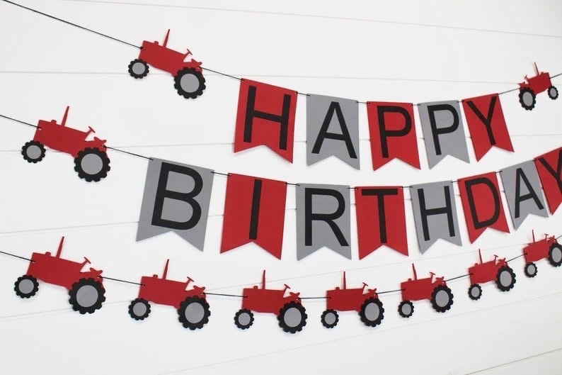 May include: Red and gray banner with the words "Happy Birthday" and red tractor cutouts.