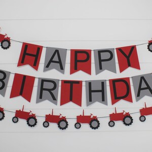 May include: Red and gray banner with the words "Happy Birthday" and red tractor cutouts.