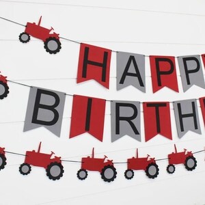 May include: Red and gray banner with the words "Happy Birthday" and red tractor cutouts.