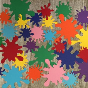 May include: A collection of colorful paper paint splatters in various sizes. The splatters are in shades of red, orange, yellow, green, blue, purple, and pink.