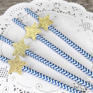 May include: Blue and white striped paper straws with gold glitter star embellishments.