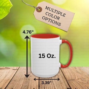 May include: A white 15 oz. mug with a red interior and handle. The mug is 4.76 inches tall and 3.39 inches wide. The tag above the mug reads "MULTIPLE COLOR OPTIONS".