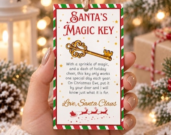 May include: A rectangular white tag with red and green striped borders featuring the text Santa's Magic Key, a gold key illustration, and a poem about Christmas Eve. The tag includes a small red silhouette of Santa's sleigh and reindeer.