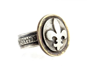 An amazing coin ring with the White Lily coin medallion fleur de lis jewelry fleur de lis ring