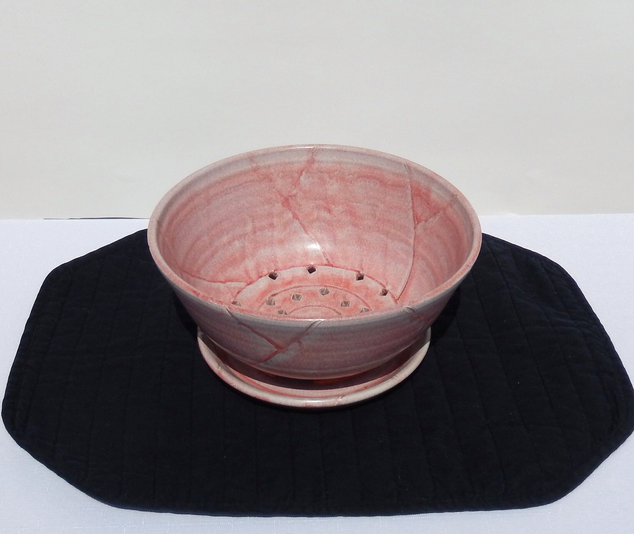 Stoneware berry bowl with saucer Iron red with golden lip.