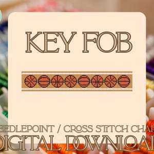 May include: A digital cross-stitch chart with the text "KEY FOB" in brown. Below the text is a brown and white border with basketballs. The words "NEEDLEPOINT / CROSS STITCH CHART" and "DIGITAL DOWNLOAD" are also present.