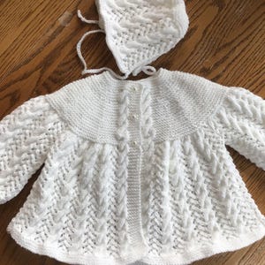 New hand knit baby layette in white