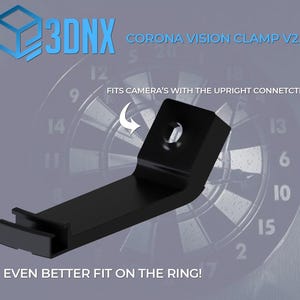 May include: A black 3DNX Corona Vision Clamp V2.0 with an angled design. Text on the image reads: 3DNX CORONA VISION CLAMP V2.0, FITS CAMERA'S WITH THE UPRIGHT CONNETCTION!, and EVEN BETTER FIT ON THE RING! The clamp features a central mounting hole.