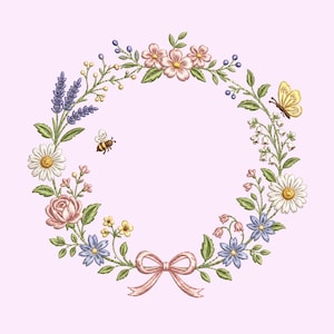 May include: An embroidery design featuring a circular floral wreath composed of pink roses, white daisies, purple lavender, and blue flowers with green leaves. A yellow butterfly, a small bee, and a light pink ribbon bow are included.
