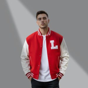 May include: Red and cream varsity jacket with the letter "L" on the chest. The jacket has a button-up front, striped cuffs, and a collar. The sleeves are cream-colored, and the body is red. A classic style.