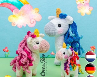 May include: Three crocheted unicorn amigurumi toys with different colored manes. The unicorns are white with pink, blue, and rainbow colored manes. The unicorns are standing on a green surface with flowers and a rainbow in the background.