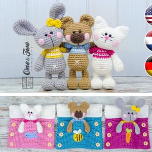May include: Three crocheted stuffed animals: a gray bunny, a brown bear, and a white cat. Each animal is wearing a different colored sweater. The animals are sitting on a white surface. Below the animals are three crocheted pouches with different colored fabrics and designs. The pouches have a small crocheted animal inside each one.