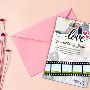 May include: A wedding invitation with a photo of a couple kissing in front of the Eiffel Tower, the word "love" in cursive, and the names "Samantha & John." The invitation is on a light pink background with a matching envelope and decorative flowers.